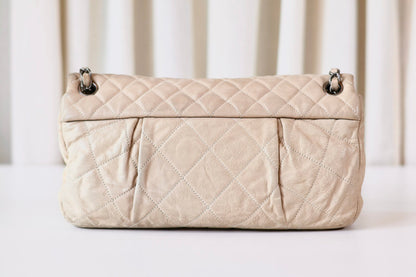 Chanel single flap bag beige