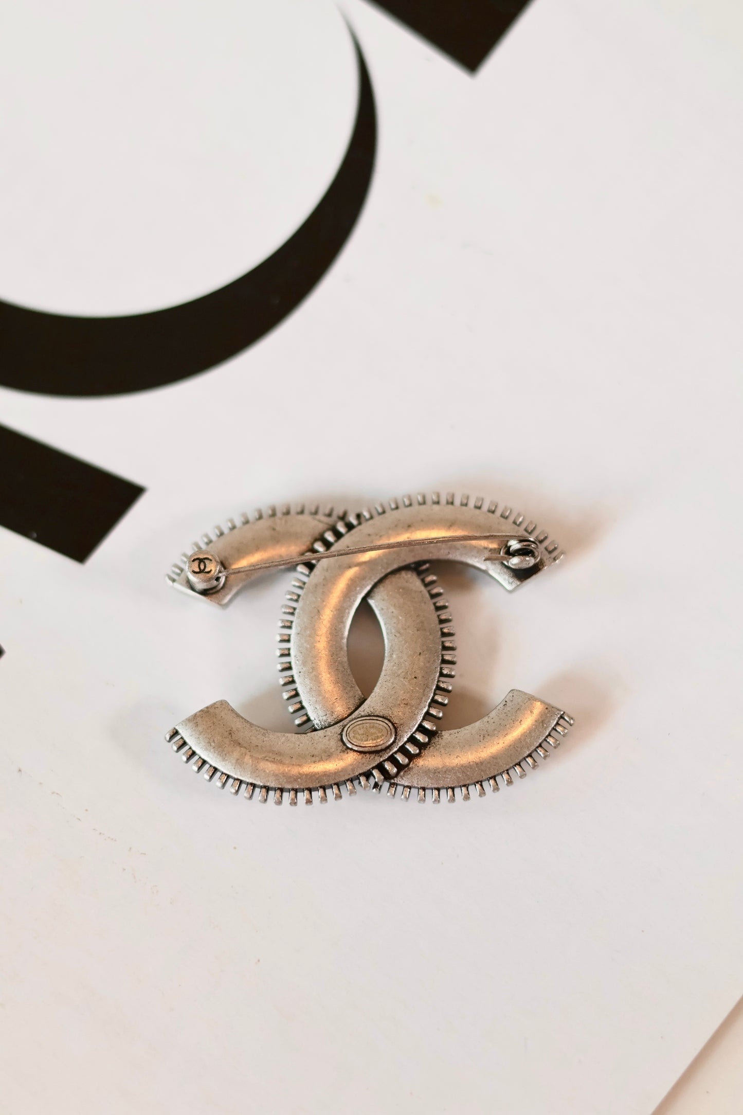 Chanel chrome brooch