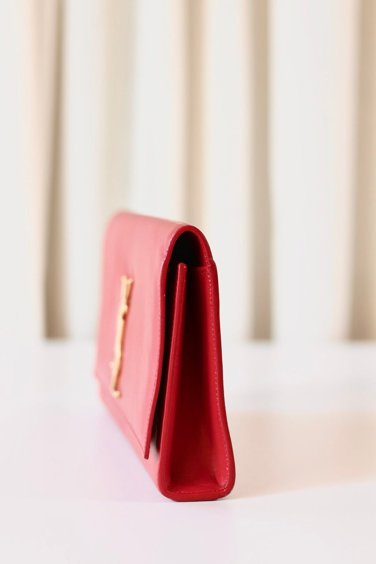 Saint Laurent red clutch