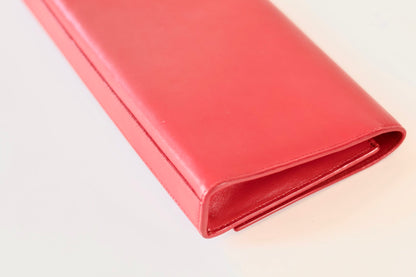 Saint Laurent red clutch